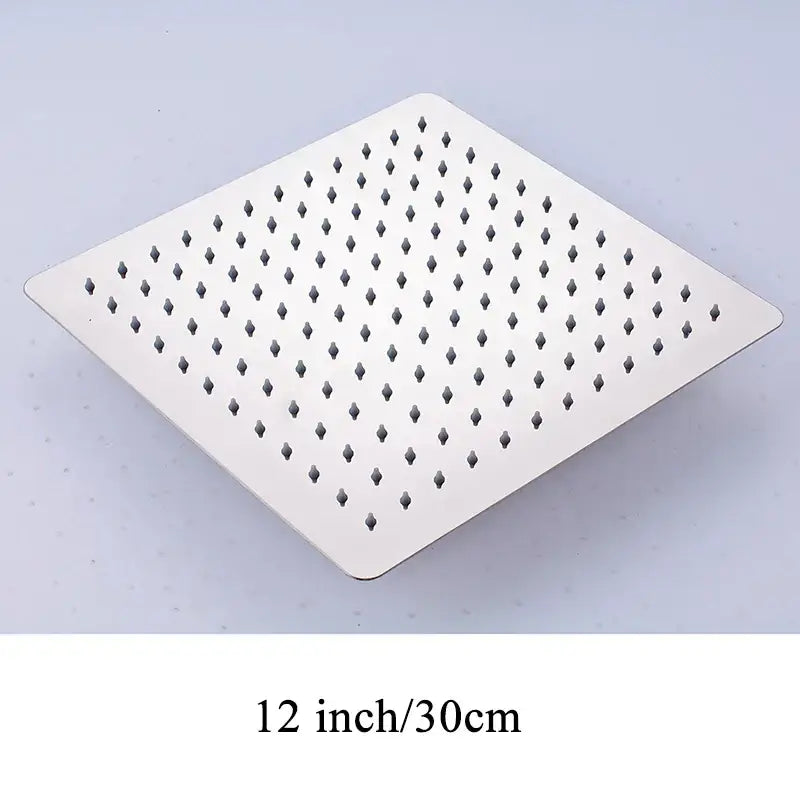 Modern white chrome square stainless steel rainfall shower head with a grid of evenly spaced diamond-shaped nozzles