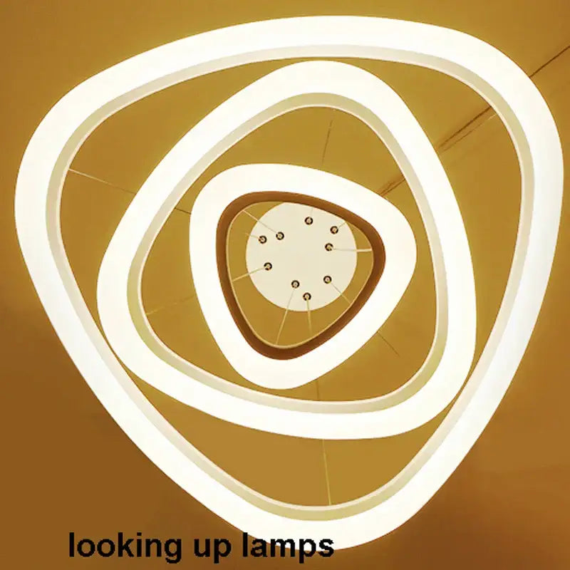 Modern white circle rings acrylic pendant lights featuring concentric triangular rings and central circular LED fixture