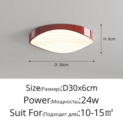 A modern decorbites circular chandelier with a glossy red oval frame and softly diffused white illuminated panel