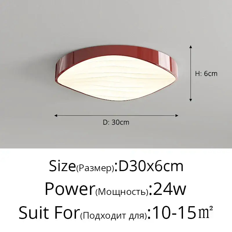 A modern decorbites circular chandelier with a glossy red oval frame and softly diffused white illuminated panel
