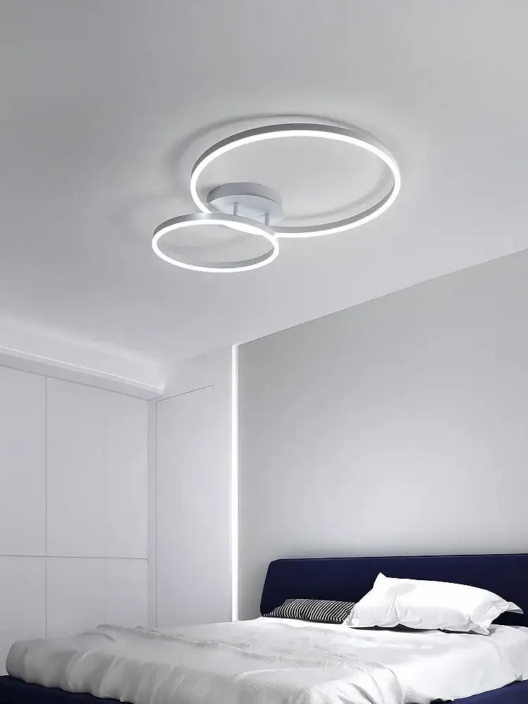 Modern white circular led decorbites ceiling lamp set featuring two interlocking rings for bedroom lighting