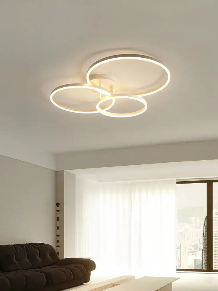 Modern white circular led decorbites ceiling lamp set featuring three interlocking rings for bedroom lighting
