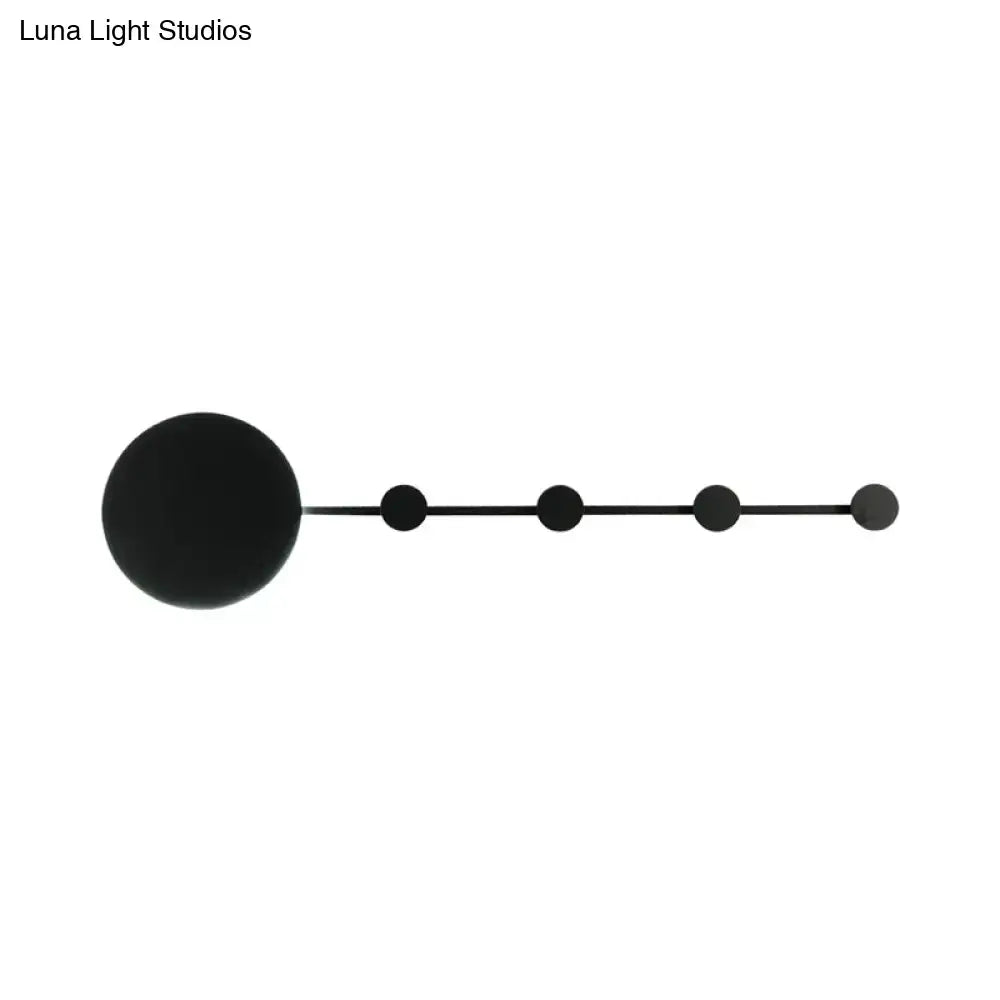 Black minimalist wall lamp with large spherical fixture and four smaller spheres along elongated arm bulb included light fixture