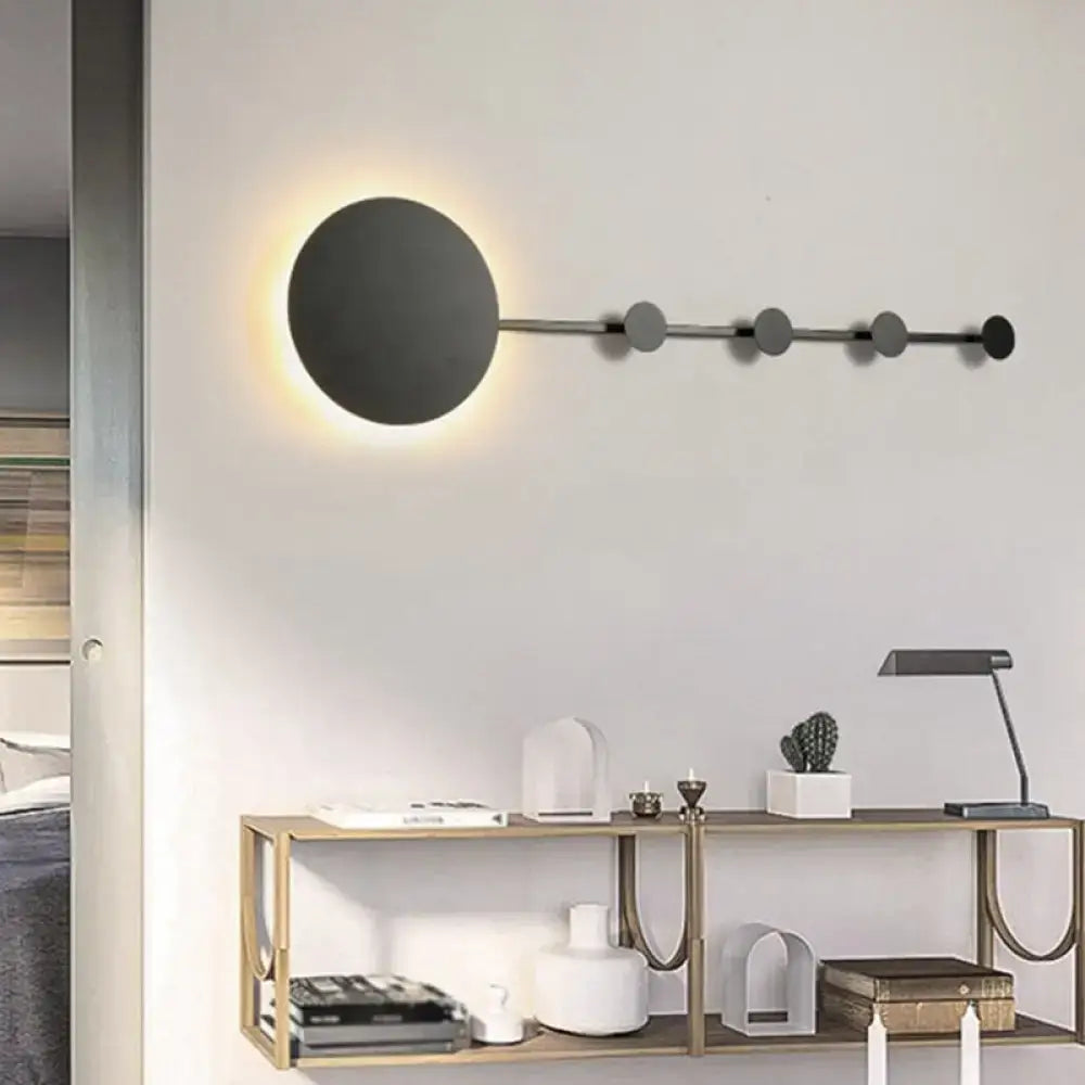 Modern black circular wall lamp with sleek metallic rod and bulb included for bedroom light fixture use