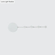Modern white circular led wall lamp with sleek metallic rod and five frosted glass orbs bulb included light fixture