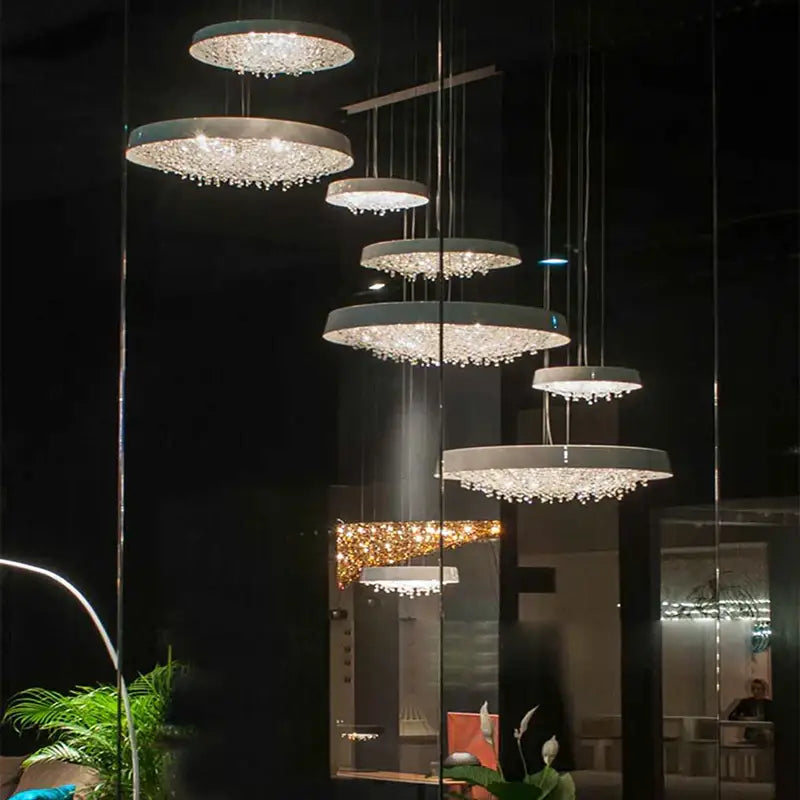 Modern white clear crystal pendant light with tiered circular metallic frames and cascading crystal droplets for living room decorbites clear crystal pendant light