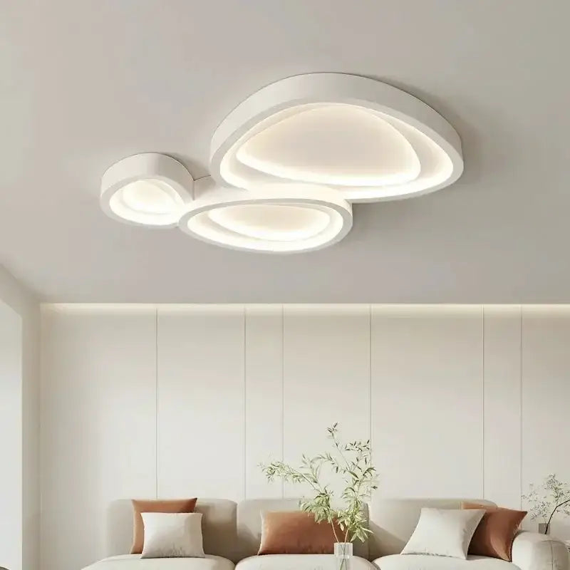 Modern white cloud designer ceiling light with layered circular rings and soft ambient glow for living room decorbites designer ceiling lights