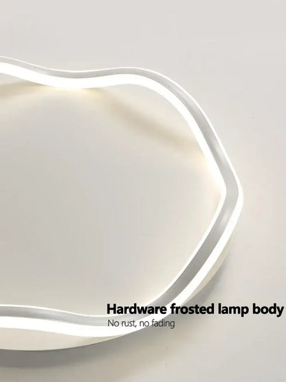 Modern white cloud led ceiling lamp with frosted curved body and integrated light strip for bedroom ceiling use