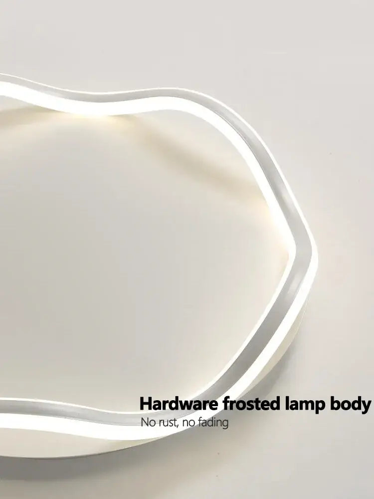 Modern white cloud led ceiling lamp with frosted curved body and integrated light strip for bedroom ceiling use