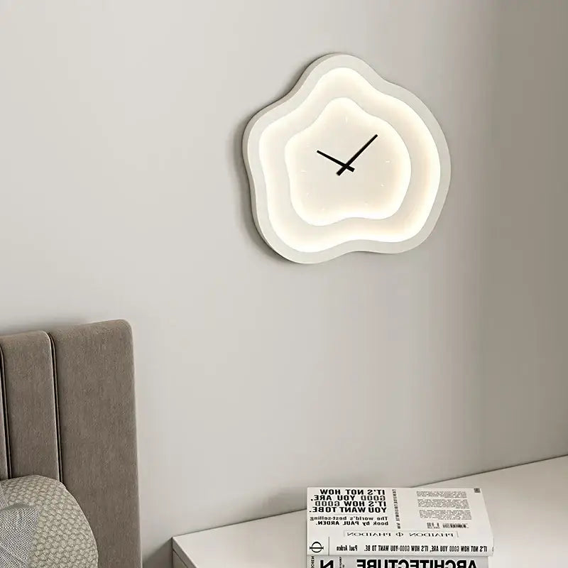 Modern white cloud-shaped led wall lamp with glowing illumination and minimalist black hands for bedroom use