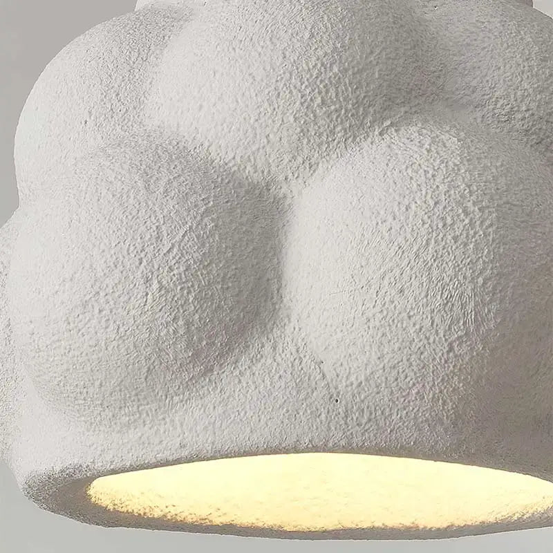 Modern white cloud pendant light with textured ceramic sculpted design for dining room decorbites green nordic modern