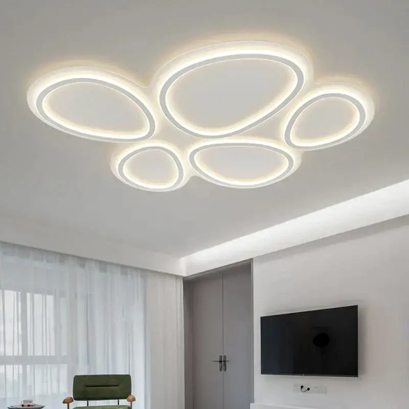 Modern white cloud ring led ceiling light with five interconnected oval rings emitting warm white light for living room decorbites circular lumines panel