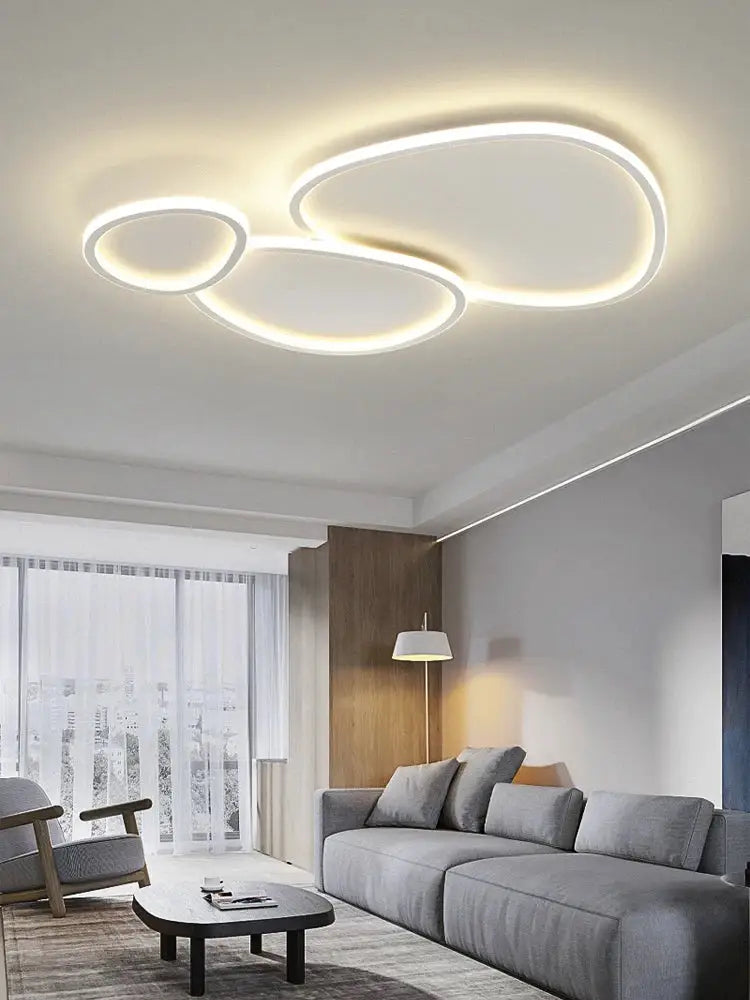 Modern white cobblestone led ceiling lights living room chandelier with sleek interconnected circular design and warm white illumination
