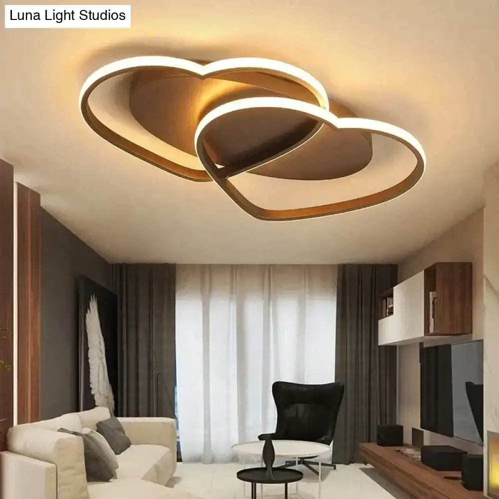 Modern gold-toned led pendant light with interlocking heart shapes for white coffee bedroom decor