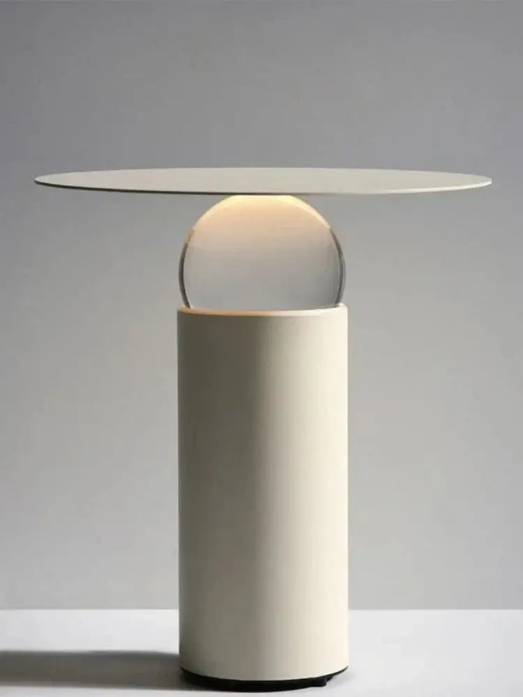 Modern white crystal ball table lamp with sleek cylindrical base and warm light glass sphere for minimalist decorbites crystal ball decor