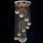 A modern white decorbites crystal led chandelier with cascading faceted crystals for villa living room decor