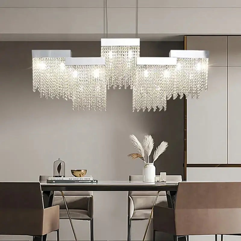 Modern white crystal tassel chandelier with sleek metal frame and clear droplets for dining room decorbites crystal tassel lighting