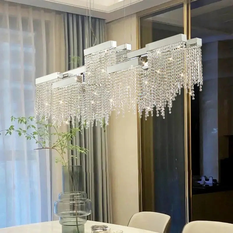 A modern white crystal tassel chandelier with a silver frame and clear beads for dining room decorbites crystal tassel decor