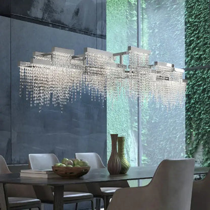 Modern white crystal tassel chandelier with cascading crystal droplets and sleek metallic frame for dining room decorbites decor