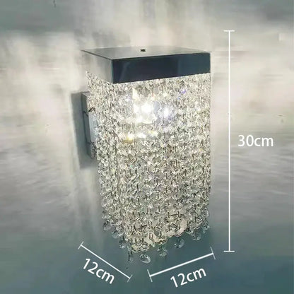 A sleek 30cm tall modern black wall-mounted decorbites crystal tassel chandelier with clear droplets for dining room decor