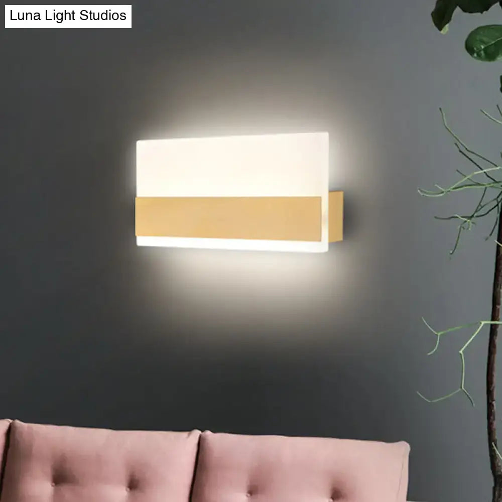 Modern white cuboid design wall sconce with gold-toned accent and sleek diffuser providing white warm light
