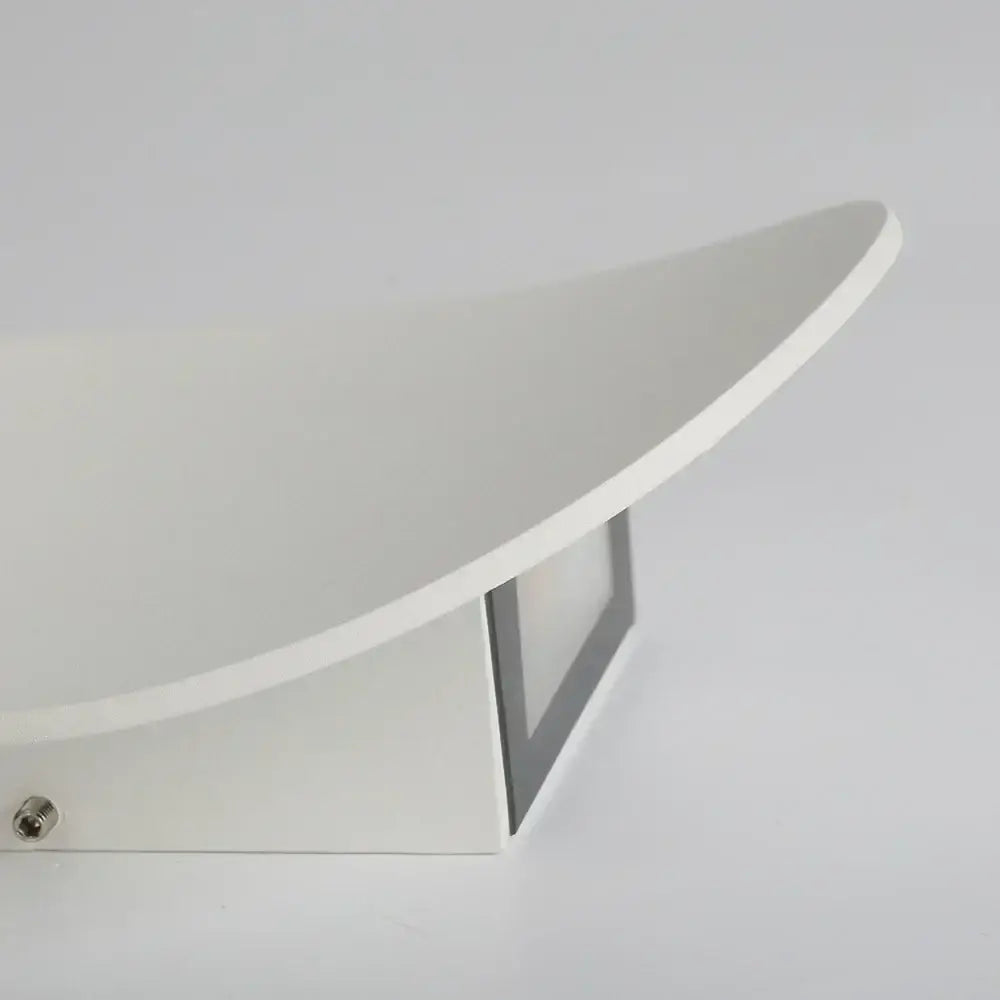 Modern white curved led wall lamp with sleek metallic base designed as a wall lamp for bedroom lighting