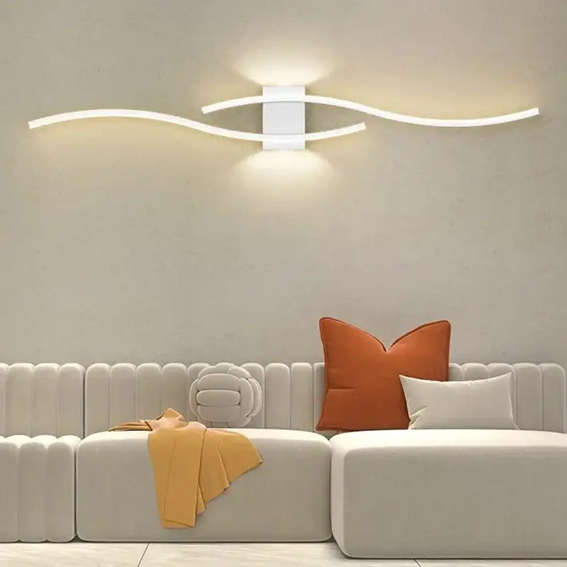 Modern white curved led wall light strip with sleek arms and central fixture for decorbites led wall use