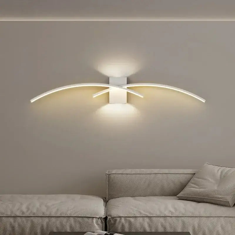 Modern white curved led wall light strip with sleek arms emitting warm glow for decorbites led wall sconce decor