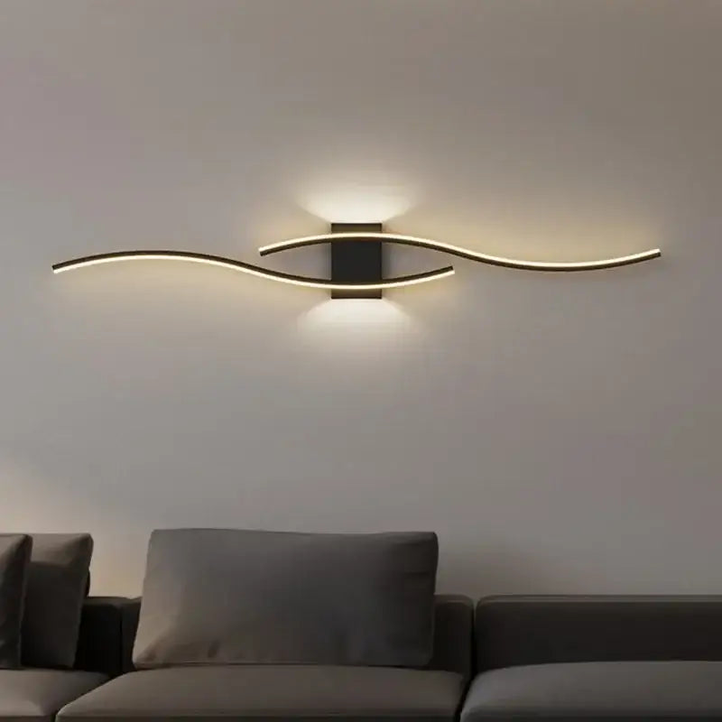 Modern black led wall light with curved arms emitting warm glow perfect as decorbites led wall strip sconce