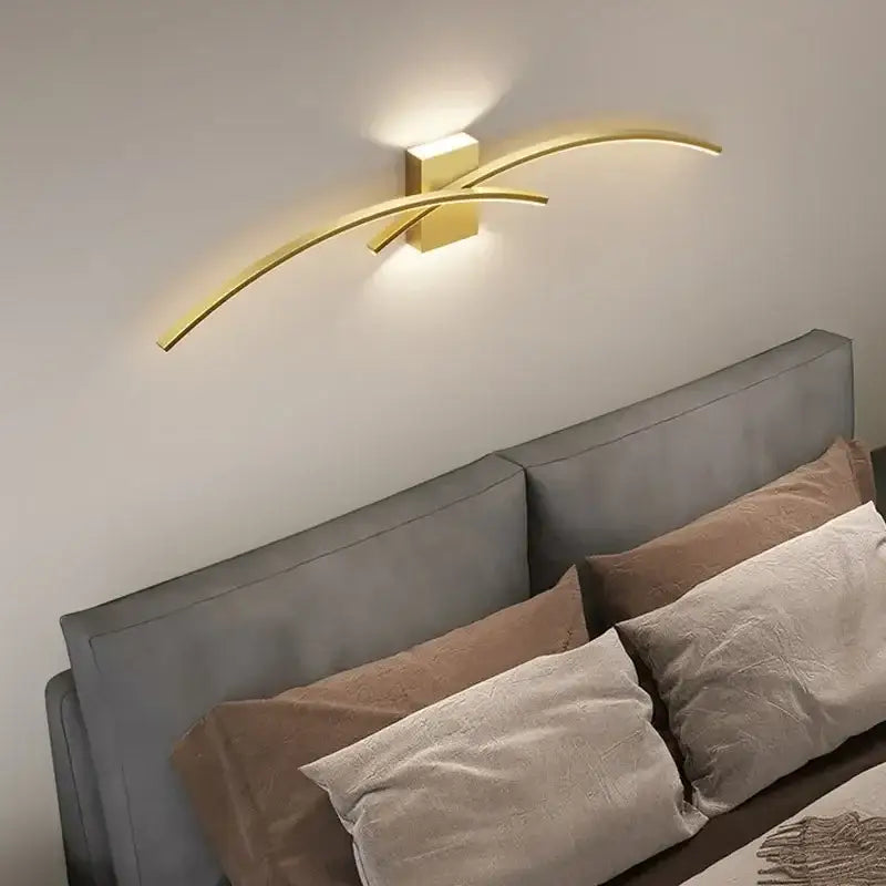 Modern white curved led wall light strip with gold-toned sleek arms and square base for decorbites led wall lighting