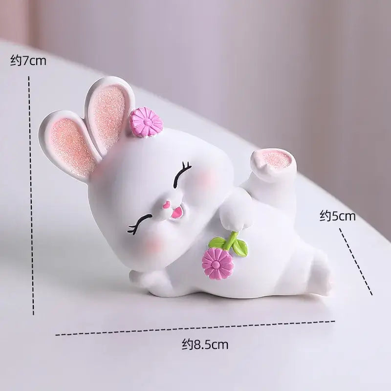 Modern white ceramic cute bunny figurine sculpture with glittery pink ears and flower, ideal for bedroom decor