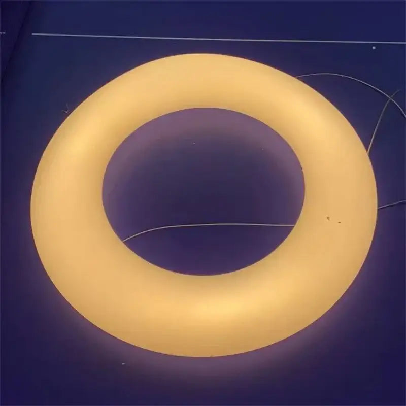 Modern white and dark gray cloud pendant light with a glowing yellow inflatable ring decorbites cloud pendant for living room