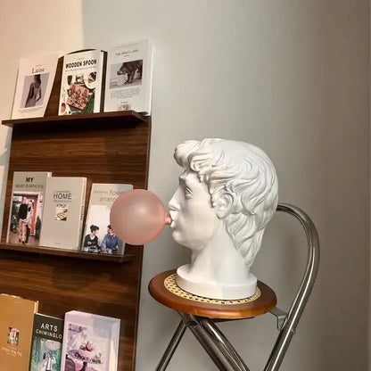Modern white david sculpture table lamp featuring a marble-style bust with pink bubblegum bubble decorbites david sculpture
