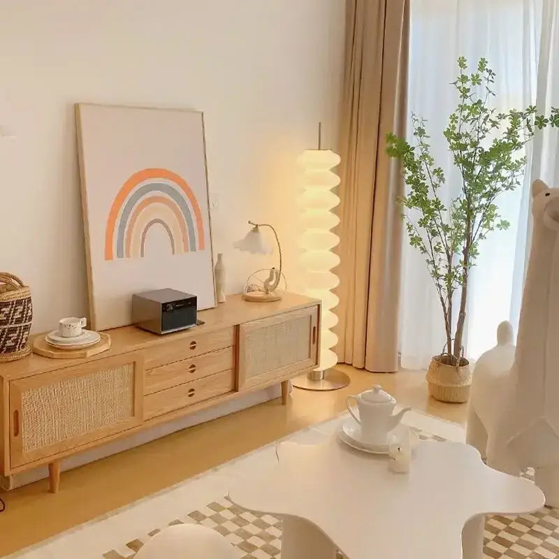 Minimalist wooden sideboard with woven rattan panels and natural light finish paired with decorbites cream sugar gourd floor lamp
