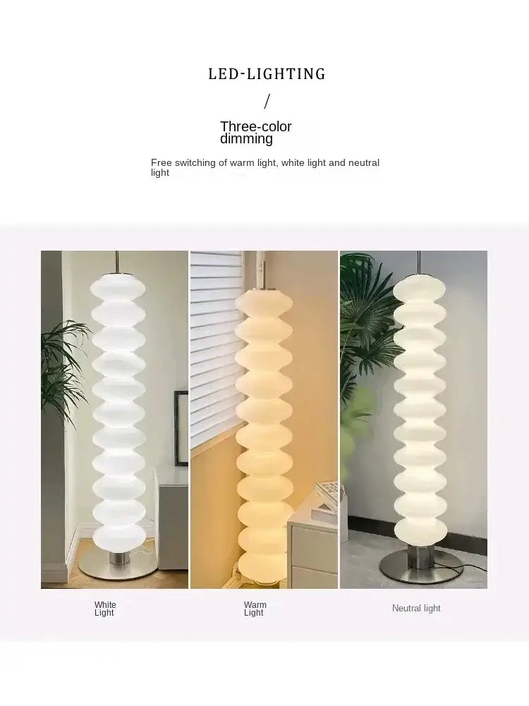 A modern white decorbites cream sugar gourd floor lamp with a segmented spiral design and metallic base for living room