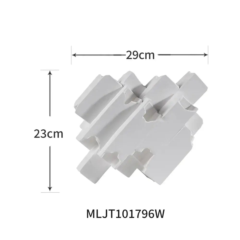White plastic interlocking puzzle piece sculpture showcasing block splicing for modern home decor decorbites geometric ceramic style