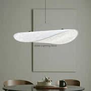 A modern white cloth cover pendant chandelier with a textured swirling design for bedroom decorbites designer cloth