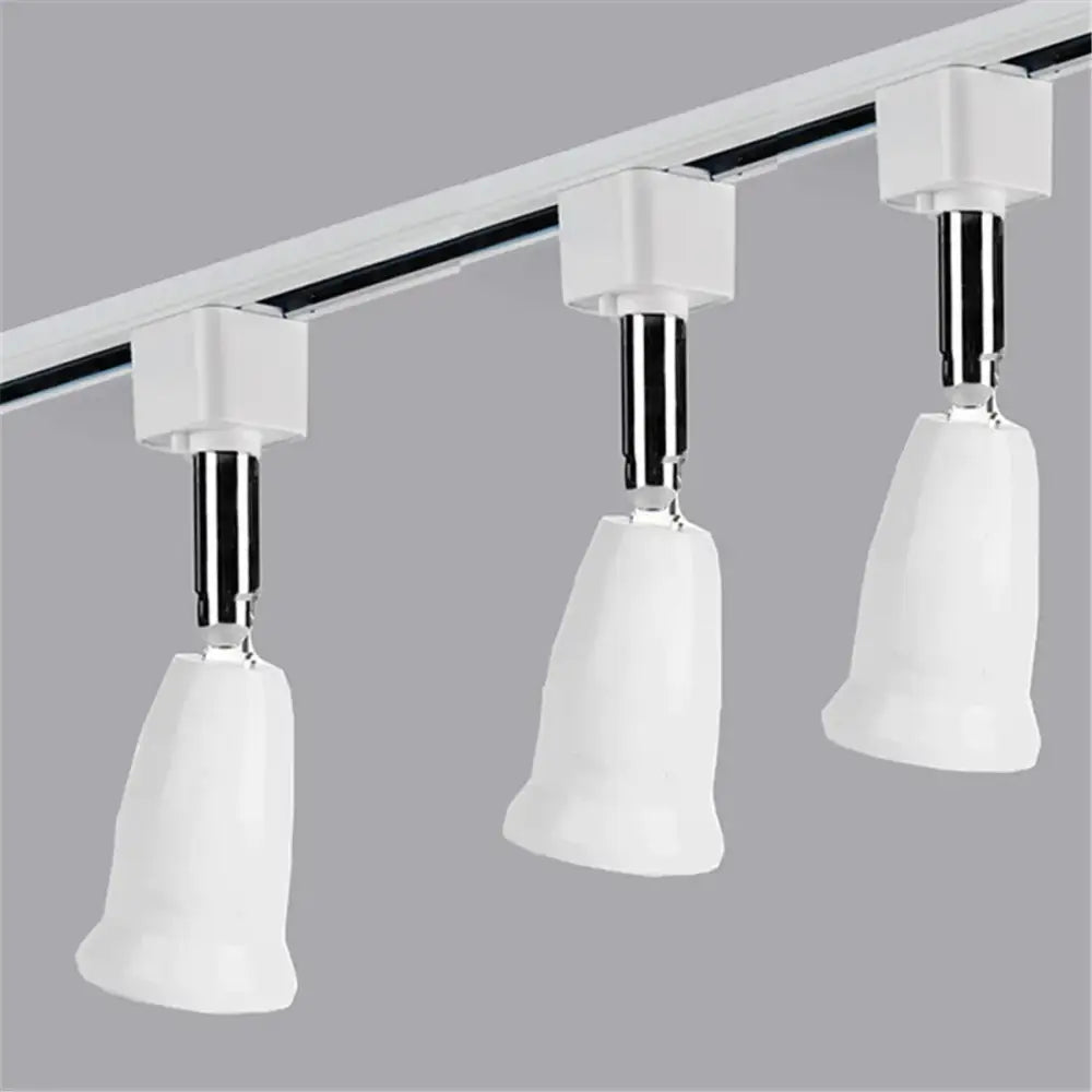 Modern white dimmable led track lighting fixture with ceramic bell-shaped heads and chrome adjustable arms for living room art
