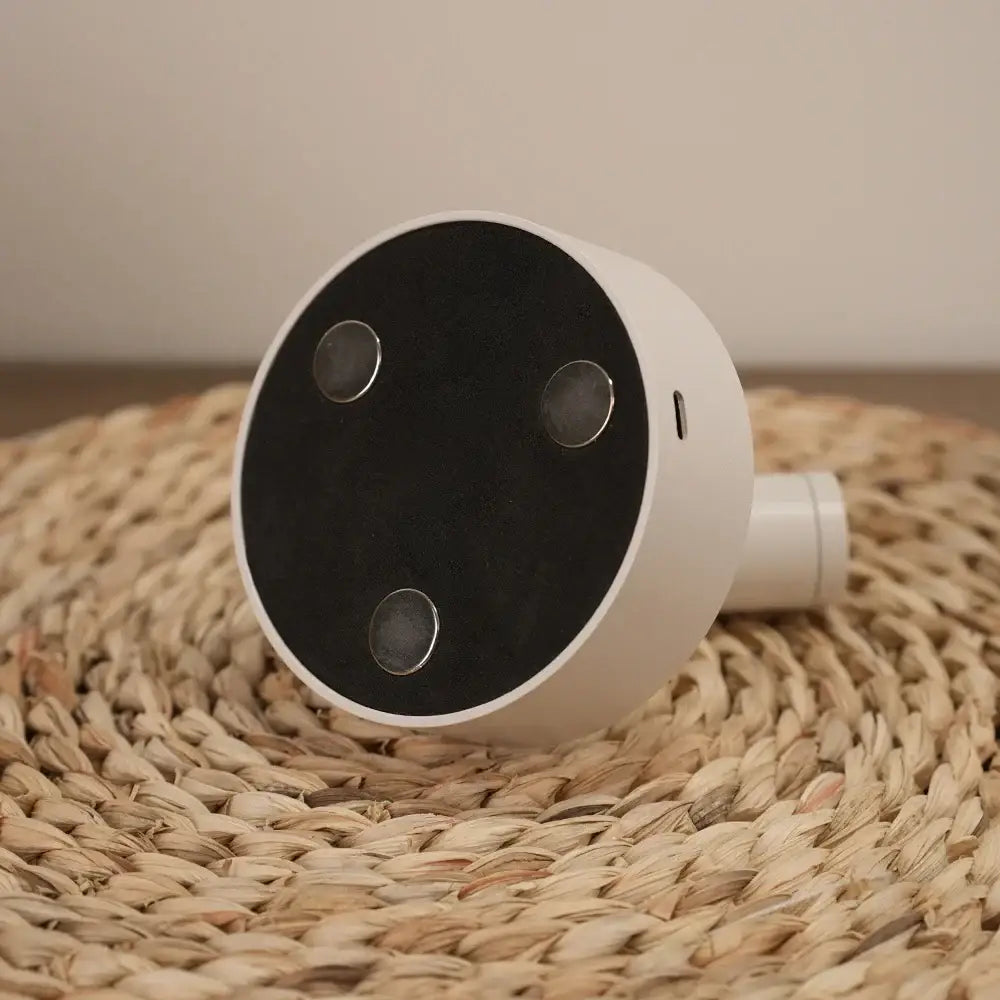 Modern white dimmable wireless smart doorbell with black panel, three silver sensors, and usb-c port for wireless wall mounted use