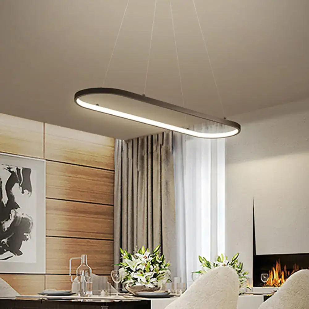 Modern oval pendant light with black metal frame and warm white led illumination for restaurant ceiling fixture