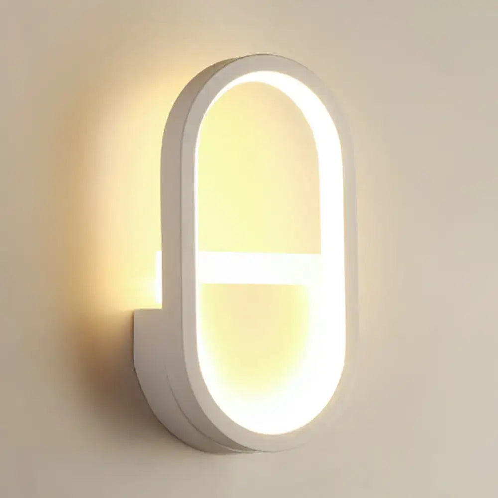 Modern white elliptical led wall lamp with warm glowing light and sleek minimalist design for bedroom use
