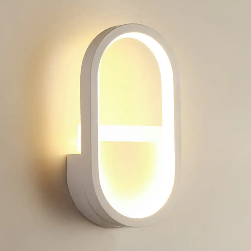 Modern white elliptical led wall lamp with sleek minimalist design and warm lighting for bedroom sconce use
