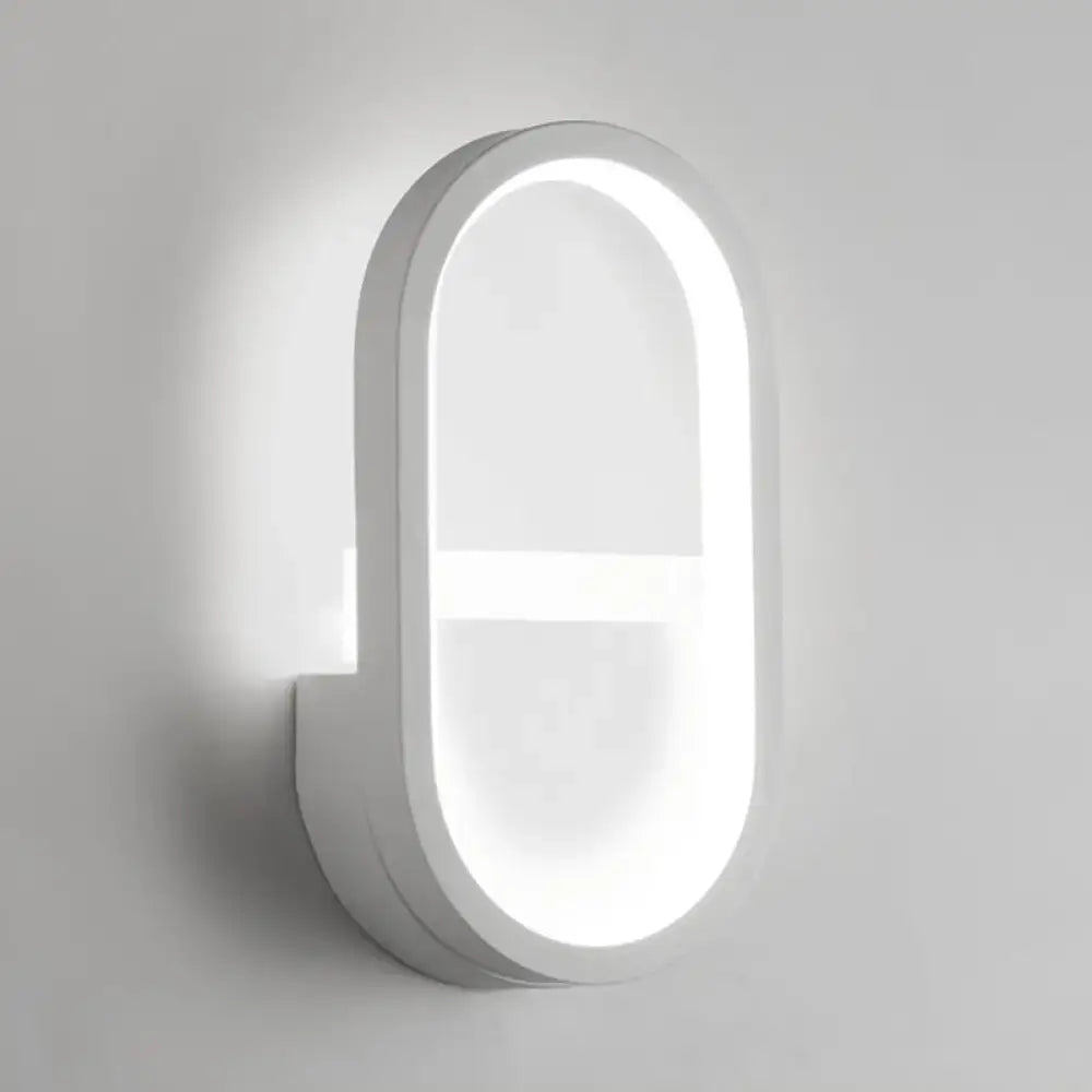Modern white elliptical led wall lamp featuring a sleek oval design with soft glowing illumination for bedrooms
