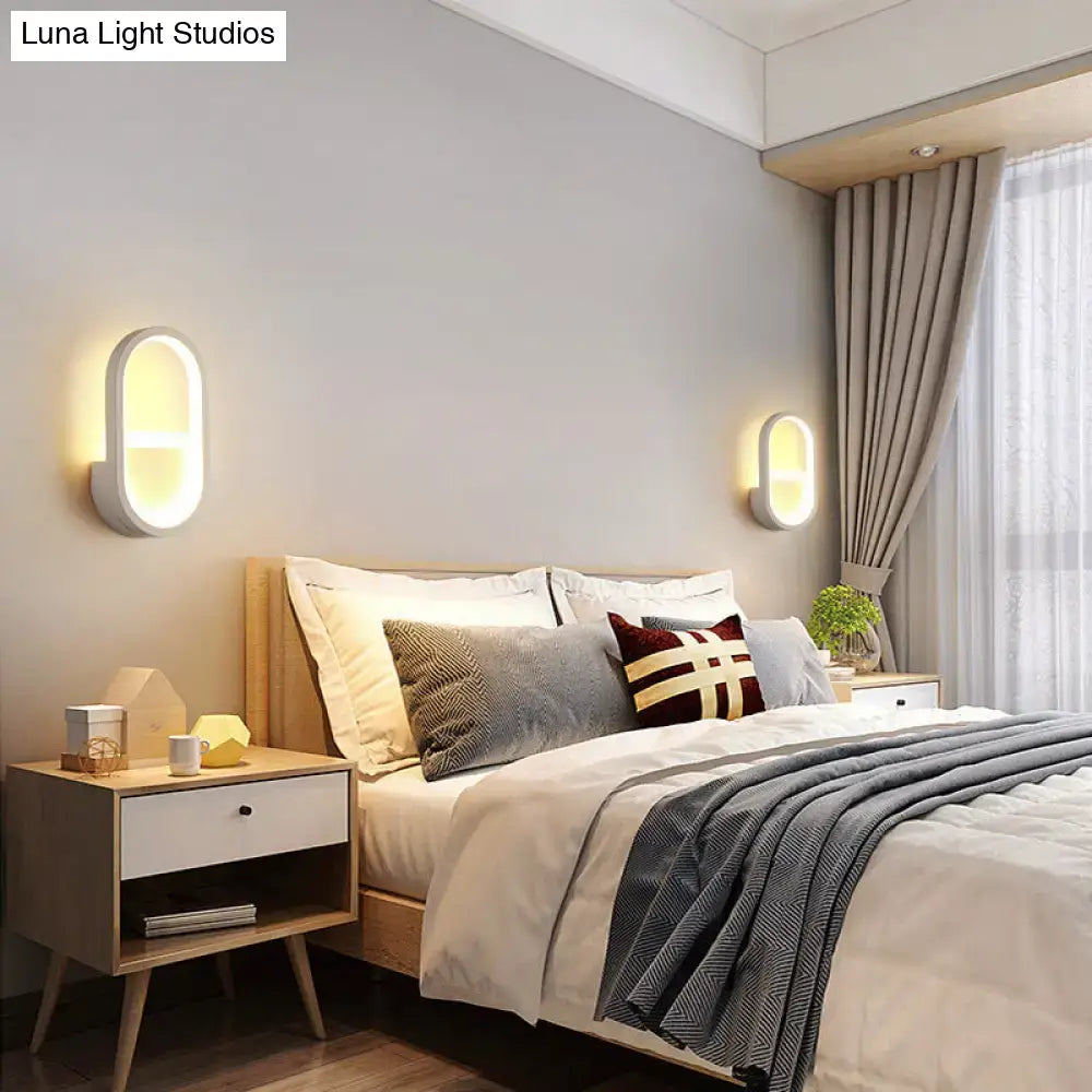 Modern white elliptical led wall lamp featuring oval-shaped wall sconces with sleek finish and warm diffused lighting