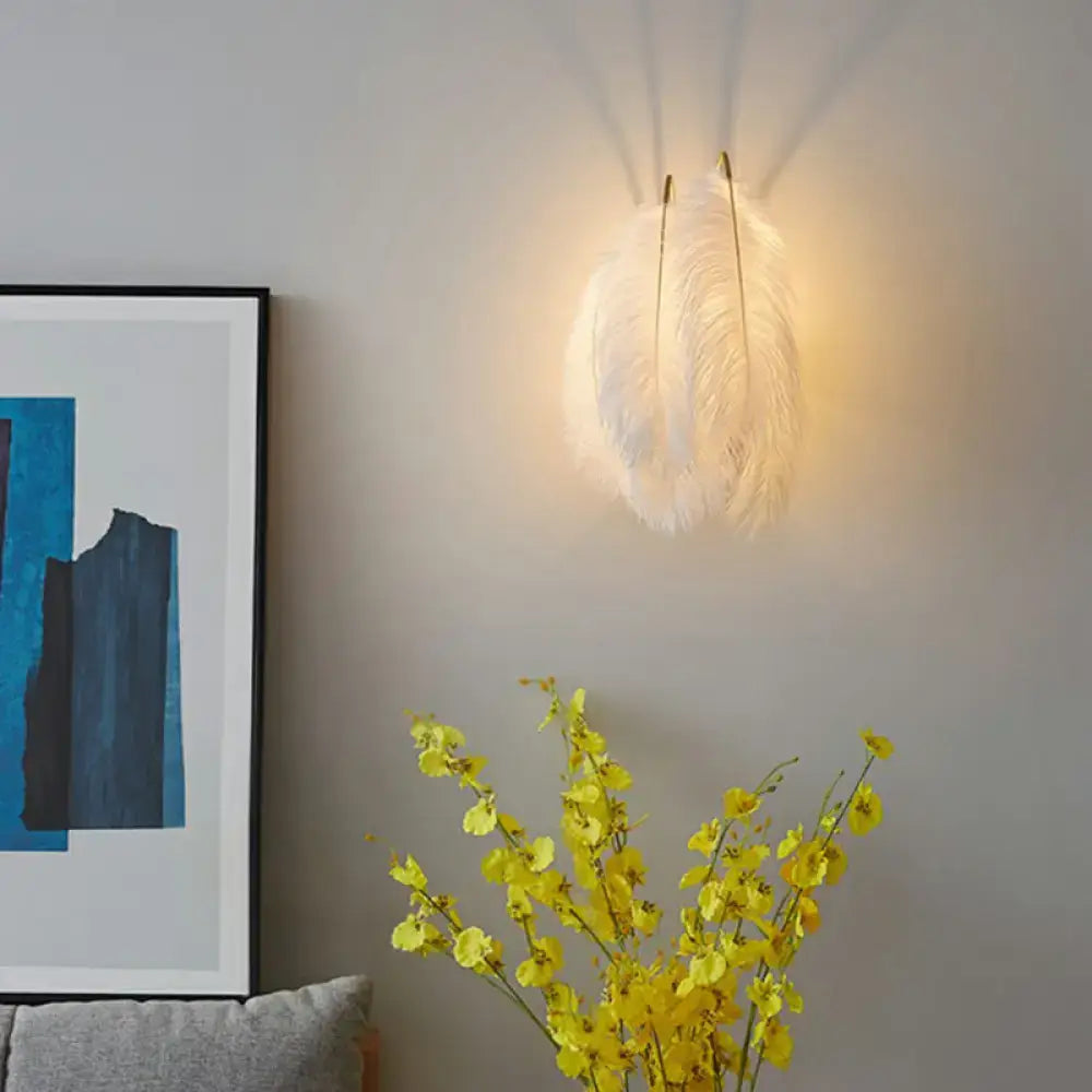Modern white feather wall sconce with soft white feathers and warm glow for bedroom single bulb lighting