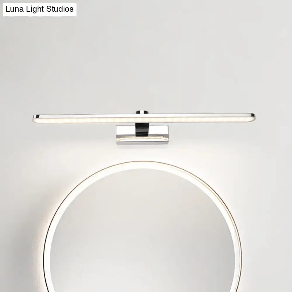 Modern white finish wall light bathroom sconce with chrome finish and led bulb mounted above a circular mirror