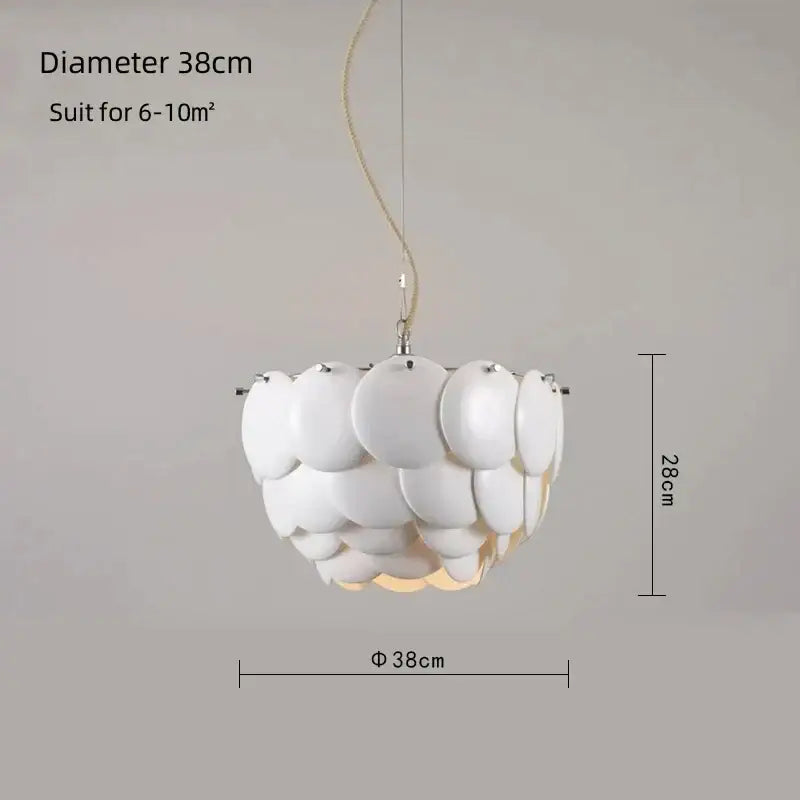 Modern white french ceramic chandelier pendant light with layered shell design and beige cord by decorbites french ceramic