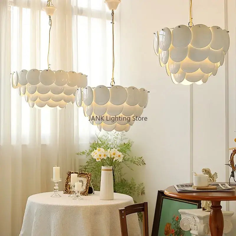 Modern white french ceramic chandelier with glossy scalloped disc pendant lights and gold-toned chains for living room decorbites french ceramic