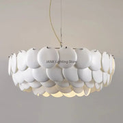 Modern white french ceramic chandelier pendant light with a layered circular disc design by decorbites french ceramic