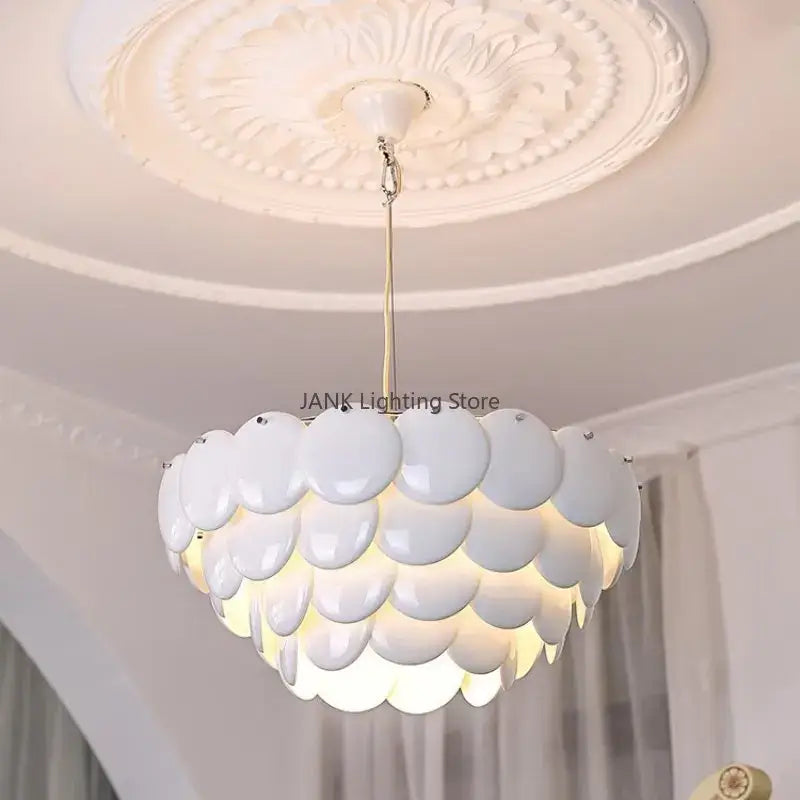 Modern white french ceramic chandelier pendant light with glossy shell design and gold-toned chain by decorbites french ceramic